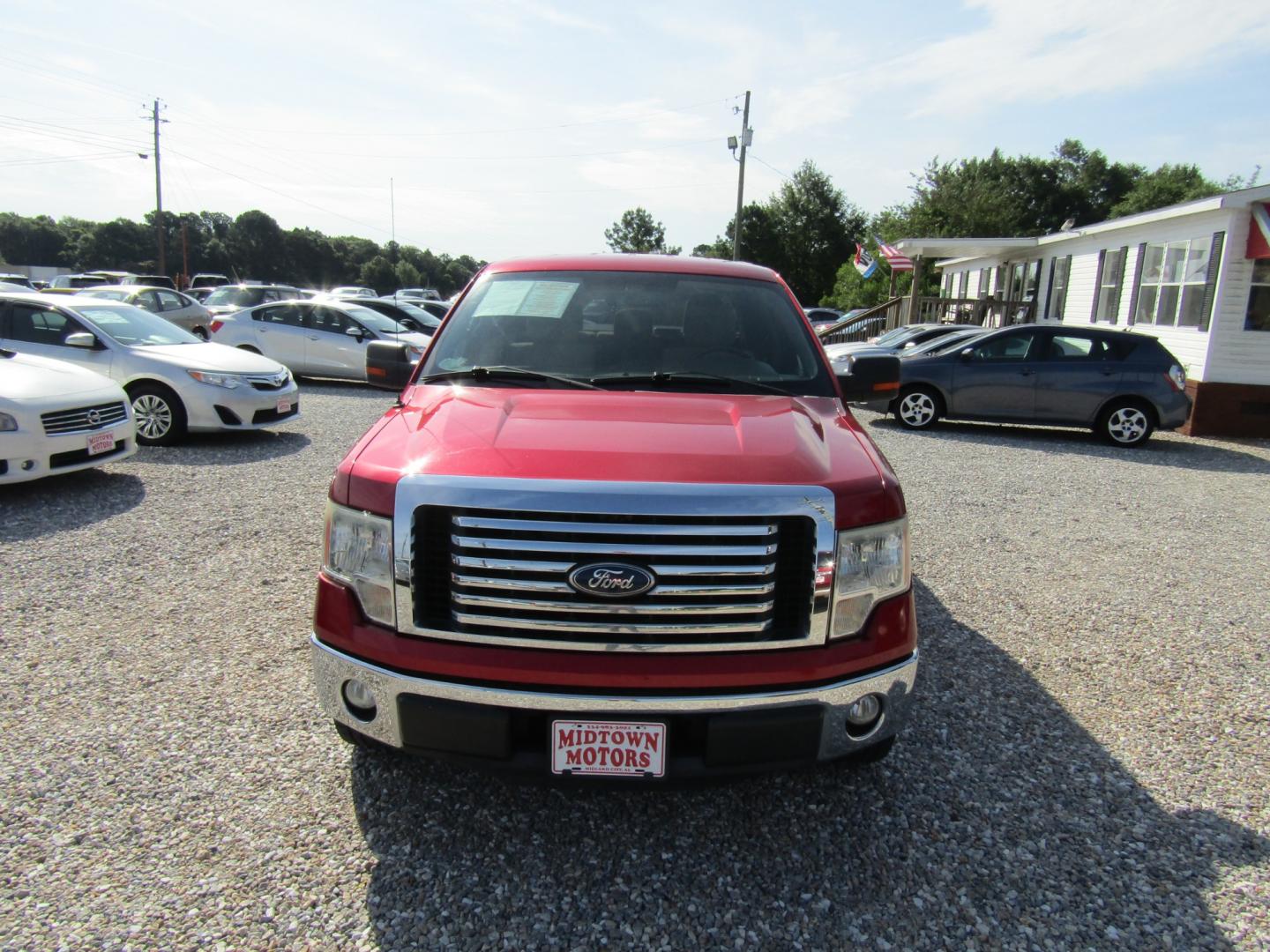 2011 Red /Tan Ford F-150 FX2 SuperCrew 5.5-ft. Bed 2WD (1FTFW1CF2BF) with an 5.0L V8 engine, Automatic transmission, located at 15016 S Hwy 231, Midland City, AL, 36350, (334) 983-3001, 31.306210, -85.495277 - Photo#1